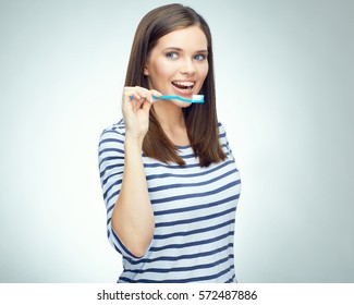 Young Woman With Brace Brushing Teeth. Isolated Portrait.