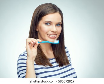 Young Woman With Brace Brushing Teeth. Isolated Portrait.