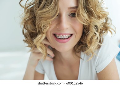 Young woman in braces - Shutterstock ID 600152546