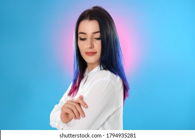 Young woman and bright dyed hair color background