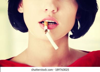 Young Woman With Broken Cigarette. Stop Smoking Concept.