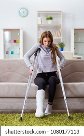 Young Woman With Broken Leg At Home