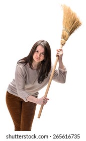 Young woman with broom on a white background