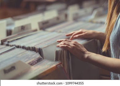 Young Woman Browsing Records In A Vinyl Record Store