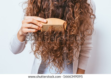 Similar – Image, Stock Photo Unrecognizable curly haired woman admiring mountains