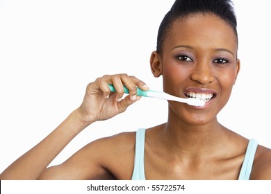 Young Woman Brushing Teeth In Studio