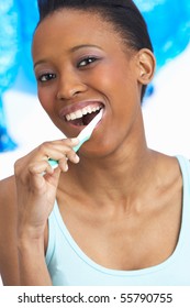 Young Woman Brushing Teeth In Studio