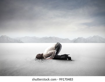 Young Woman Burying Her Head In The Sand