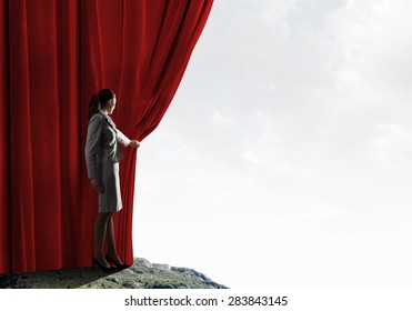 Young Woman In Business Suit Opening Color Curtain Of Stage