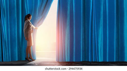 Young Woman In Business Suit Opening Color Curtain Of Stage