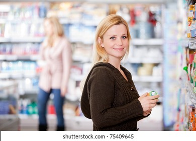 A Young Woman Buying Groceries In A Grocery Store