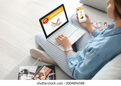 Young Woman Buying New Shoes Online At Home