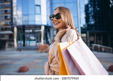 Young woman by the shopping center - Shutterstock ID 1887079969