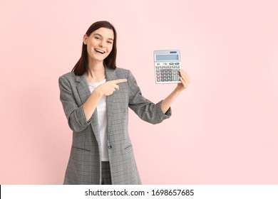 Young Woman With Calculator On Color Background