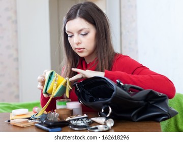 Young Woman Can Not Finding Anything In Her Purse