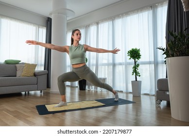 Young Woman Cancer Survivor Practicing Home Workout Yoga Training, Stretching Muscles And Breathing Exercise For Healthy Life After Long Struggle With Sickness And Pain.