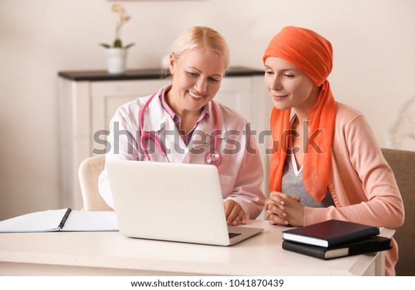 Young woman\
with cancer visiting doctor in\
hospital