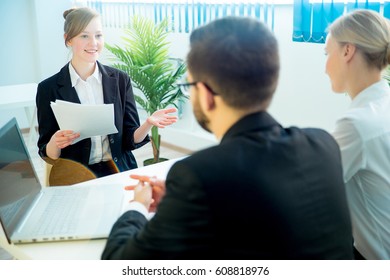 A Young Woman Candidate Is Explaining Something