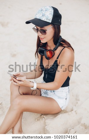 Similar – Foto Bild fröhliche Frau mit langen Haaren auf Kopfhörer hört Musik.