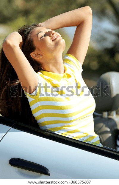 Young woman in the car\
outside