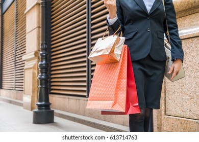 Young Woman Carrying Shopping Bags