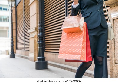 Young Woman Carrying Shopping Bags