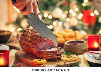 Young Woman Carving Glazed Holiday Ham