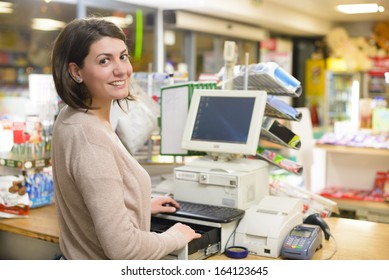 Young Woman At Cash Register In A Store