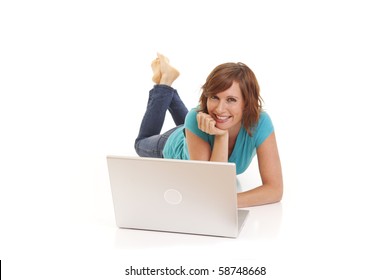 Young Woman Casually Laying On Floor With Laptop