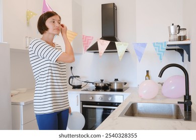 Young woman celebrates her birthday at home, surrounded by cozy atmosphere and festive decorations. She cooking a festive dinner, delicious pasta - Powered by Shutterstock