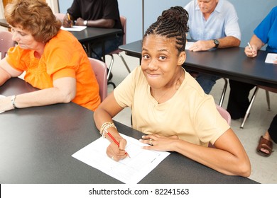 Young Woman With Cerebral Palsy In College Class.