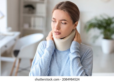 Young Woman With Cervical Collar On Neck At Home