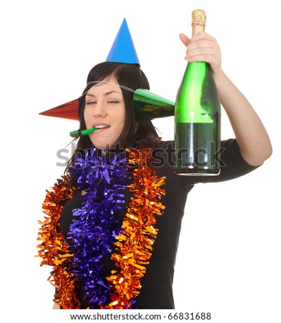 young woman in chains and cone hats with green bottle of champagne, blowing a party blower