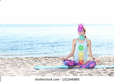 Young Woman With Chakra Practicing Zen Yoga On Beach. Space For Text