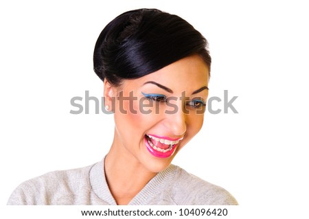 young woman cheerfully and positively laughing. happy emotions. face close up. isolated on a white background