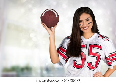 Young woman cheering for her favorite football team