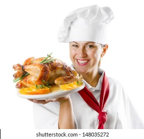 Young Woman Chef Holding A Plate With Chicken Isolated On White