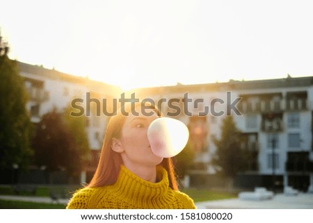 Similar – Image, Stock Photo Young teenage girl blowing pink bubble gum