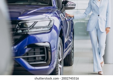 Young woman choosing a car for herself - Shutterstock ID 2002745516