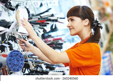 Young Woman Choosing Electric Hairdryer In Home Appliance Shopping Mall Supermarket