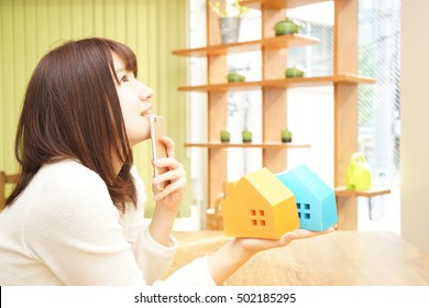 Young woman choosing home and real estate - Powered by Shutterstock