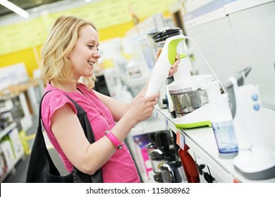 Young Woman Choosing Kitchen Mixer Blender In Home Appliance Shopping Mall Supermarket