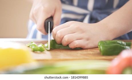 A Young Woman Chopping Vegetables