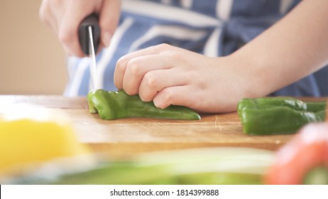 A Young Woman Chopping Vegetables