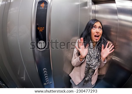 a young woman with claustrophobia in an elevator