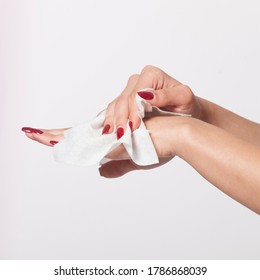 Young Woman Clean Hands With Wet Wipes. Red Nails