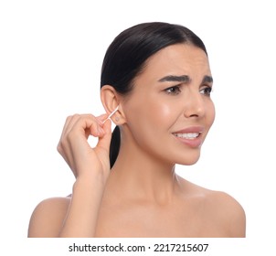 Young woman cleaning ear with cotton swab on white background - Shutterstock ID 2217215607