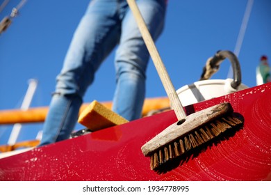 A Young Woman Cleaning Her Boat