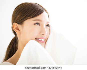 Young Woman Cleaning Her Face With  Towel