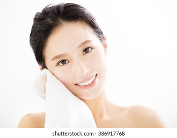 Young Woman Cleaning Her Face With  Towel